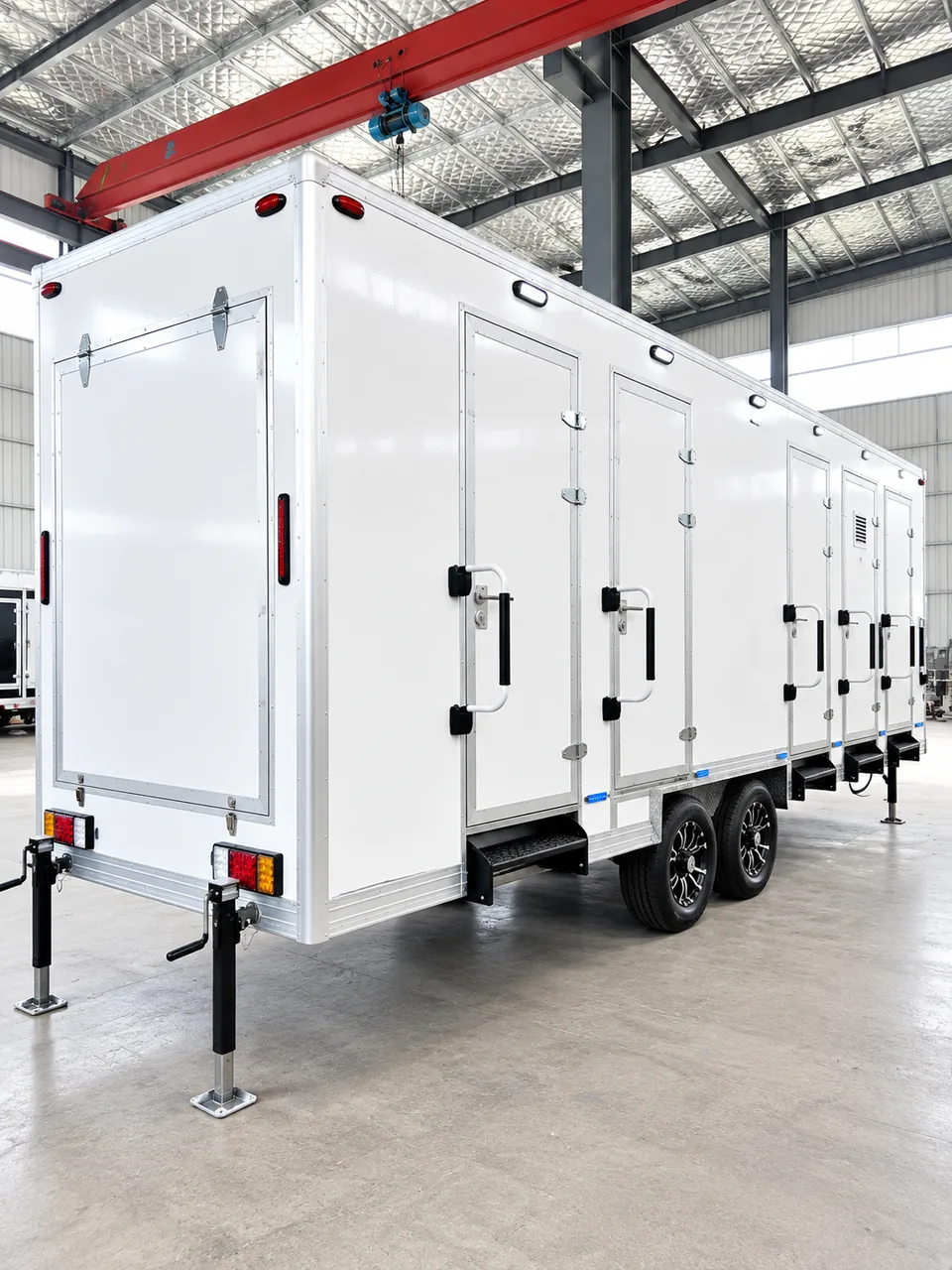 20 ft multi-door shower trailer inside a commercial facility